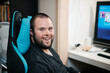 © Austockphoto - Young Man with Down Syndrome about to do some Video Gaming