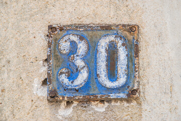 Wall Mural - Old retro weathered cast iron plate with number 30