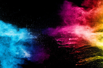 Wall Mural - Explosion of colorful Holi powder on black background. Vibrant color dust particles textured background.