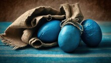 Three Blue Eggs In A Sack On A Blue And White Striped Tablecloth With A Burlap Sack On Top Of It And A Blue And White Striped Table Cloth On The Bottom.  Generative Ai