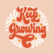 Keep growing - trendy script lettering quote in modern 70s groovy style. Inspiration hand drawn floral theme phrase with flowers illustration. Isolated 60s concept vector typography design element