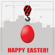 Happy easter greeting card. The crane lifts the painted egg.