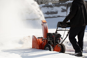 Wall Mural - A portable snow blower powered by gasoline. Snow removal in winter.