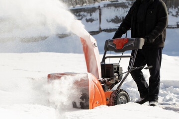 Wall Mural - A portable snow blower powered by gasoline. Snow removal in winter.