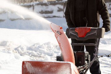 Wall Mural - A portable snow blower powered by gasoline. Snow removal in winter.