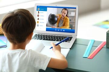 Sticker - Little boy studying online at home