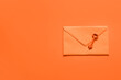 © Pixel-Shot - Envelope with key on orange background