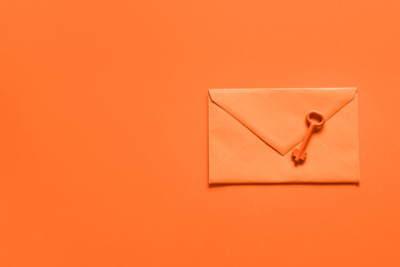 envelope with key on orange background