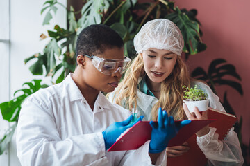 two female scientists working in the laboratory making biological test, scientific research. concept