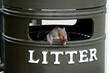 Squirrel on trash bin