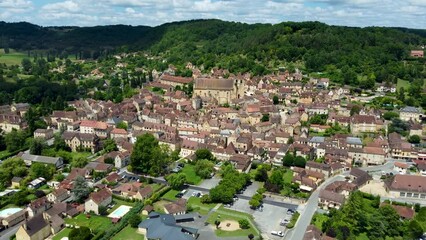 Wall Mural - 4K drone footage of Saint-Cyprien, a commune in the Dordogne department in Nouvelle-Aquitaine in southwestern France.