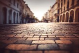 Fototapeta Uliczki - rue pavée vide vue du sol, bâtiments de pierre avec focus et flou