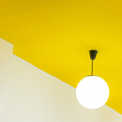 Wall Mural - round ceiling light.with yellow background