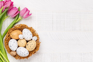 Wall Mural - Fresh pink tulip flowers and easter eggs