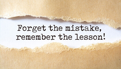 'Forget the mistake, remember the lesson' written under torn paper.