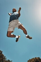 Sports, Blue Sky And Basketball Man Jump For Game, Competition Or Slam Dunk Training, Practice Or Workout. High Energy, Athlete Motivation And Basketball Player Doing Fitness Or Exercise Bottom View