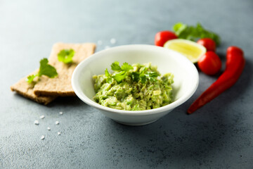 Wall Mural - Healthy mashed avocado with lime juice