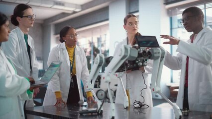 Fototapete - Diverse Team of Industrial Robotics Specialists Gathered Around a Table With a Mobile Robot. Engineers In Lab Coats Discussing an Automated AI Robotic Dog, Using Laptop Computer, Brainstorming