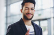 © Arcurs Co-op/peopleimages.com - Ive got this. Cropped shot of a young businessman showing winking and showing thumbs up while walking through a modern office.