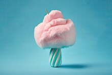 On A Blue Background, Sweet Pink Cotton Candy. Generative AI