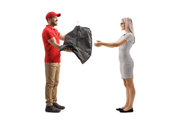 Poster - Man delivering clothes on a hanger with a cover to a woman