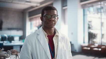 Aufkleber - Portrait of Young Handsome Black Man Wearing Glasses and a Lab Coat Looking at the Camera. Future Engineer Pursuing Scientific Career. Industrial Manufacturing Student in University Laboratory Posing