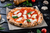 Fototapeta  - Pizza with mozzarella, tomato sauce, spinach on a thick dough.