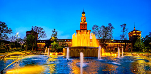 Wall Mural - Panorama of Piazza Castello with fountain and Castello Sforzesco on background at night, Milan, Italy