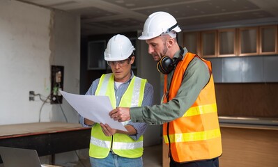 Wall Mural - Engineer team discussing meeting on plan at construction site