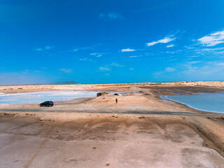 Aerial photos of Salines in Santa Maria, Sal Island in Cabo Verde showcase stunning salt flats, colorful patterns created by salt ponds, machinery used for salt harvesting