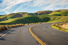 Paved Road Through The Rolling Hills Of Carrizo Plain National Monument
