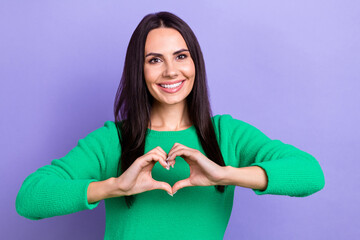 Poster - Photo of pretty adorable woman wear green pullover showing arms heart smiling isolated purple color background