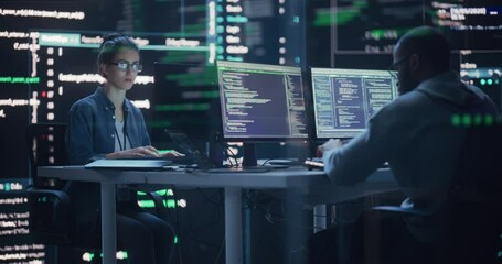 Fototapete - Diverse Young Man and Woman Working on Desktop Computers, Surrounded by Big Screens Displaying Code Lines. Professional Computer Engineers Developping Autonomous Algorithm for Generative AI