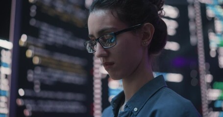 Leinwandbilder - Close Up Portrait of Woman Working on Computer, Lines of Code Language Reflecting on her Glasses from Big Display Screens. Female Programmer Developing New Software, Coding, Managing Cybersecurity