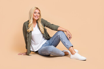 Sticker - Full length photo of lovely cheerful lady wear comfort smart casual style clothes empty space isolated on beige color background