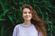 © Евгений Шемякин - portrait of young girl on a green, natural background, eco friendly woman in a tropical park or jungle, positive lady enjoys walk at garden at summer day