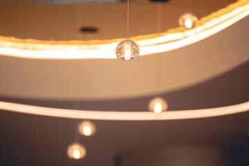 Wall Mural - Low angle shot of hanging decorative lights in a room