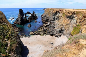 Scenic view of a rocky shore under the bright sunlight