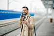 © Dusan Petkovic - Portrait of a busy young man in smart casual talking on the phone while waiting for a metro.