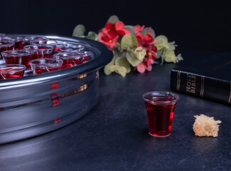 Taking communion the wine and the bread symbols on black background