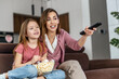 © ivanko80 - Mother with kid girl watching fun humor tv show