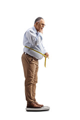 Sticker - Full length shot of a pensive mature man on a scale and measuring waist