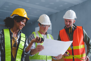 Wall Mural - Group of multi ethnic engineer construction site worker meeting at workplace, Architects working together at construction site to remodeling home or building.