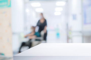 White table in modern hospital interior with empty copy space on the table for product display mockup.