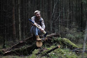 Wall Mural - A bearded lumberjack with a large ax