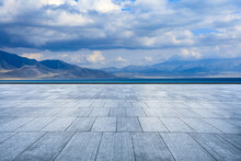 Empty Square Floors And Lake With Mountain Scenery In Xinjiang, China.