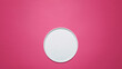 © Cavan Images - Overhead view of empty plate on pink background