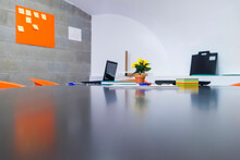 Surface Level Image Of Office Supplies On Conference Table