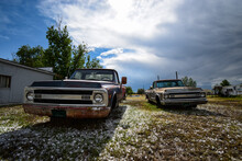Old Pickup Trucks With No Wheels And A Backyard In Colorado