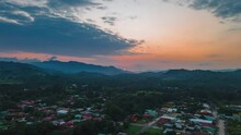 Aerial Hyperlapse Of Quepos City In Costa Rica With Orange And Blue Sky, 4k